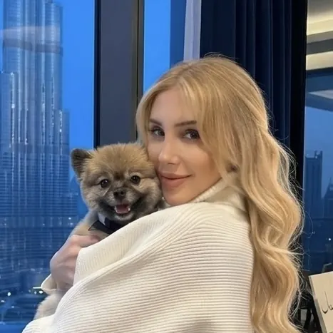 Furs Class Travel founder Kristey with Pomeranian Kio in Dubai